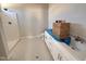 Bright bathroom with double vanity sink and walk-in shower at 221 Tee Dr, Selma, NC 27576