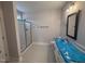 Bathroom featuring a glass-enclosed shower and vanity with modern fixtures at 221 Tee Dr, Selma, NC 27576