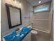 Bathroom showcasing tub shower combination and vanity with modern fixtures at 221 Tee Dr, Selma, NC 27576