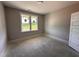 Bright bedroom with large windows and neutral walls at 221 Tee Dr, Selma, NC 27576