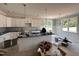Open kitchen featuring a center island, stainless steel appliances, and white cabinets at 221 Tee Dr, Selma, NC 27576