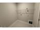 Spacious laundry room with tile flooring and ample storage space at 221 Tee Dr, Selma, NC 27576