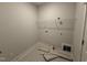Laundry room with patterned tile flooring and ample storage space at 221 Tee Dr, Selma, NC 27576