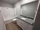 Neutral bathroom featuring granite countertops, a single sink, and a shower-tub combo at 225 Phil Jack Rd, Dunn, NC 28334