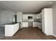 Modern kitchen with white cabinets, granite countertops, and stainless steel appliances at 225 Phil Jack Rd, Dunn, NC 28334