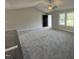 Bright living room with plush gray carpet and a ceiling fan at 225 Phil Jack Rd, Dunn, NC 28334