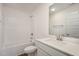 Bathroom featuring a modern vanity, large mirror, and a shower-tub combination at 231 Trescott St, Smithfield, NC 27577