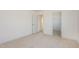 Bedroom features neutral carpeting with a door to the closet and another door to the hallway at 231 Trescott St, Smithfield, NC 27577