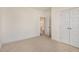 Bedroom features neutral carpeting, closet, and entry door that enhances space and functionality at 231 Trescott St, Smithfield, NC 27577
