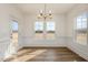 Dining room with hardwood floors, decorative trim, windows, and a chandelier at 231 Trescott St, Smithfield, NC 27577