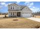 Well-maintained two-story home with attached two-car garage and a wide concrete driveway at 231 Trescott St, Smithfield, NC 27577