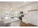Modern kitchen featuring white cabinets, stainless steel appliances, and a large center island at 231 Trescott St, Smithfield, NC 27577