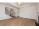 Open living area featuring staircase with iron spindles and hardwood floors throughout at 231 Trescott St, Smithfield, NC 27577