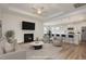 Spacious staged living room with fireplace and open concept to kitchen and dining area at 231 Trescott St, Smithfield, NC 27577
