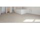 Second floor loft space, with carpeting and access to multiple rooms at 231 Trescott St, Smithfield, NC 27577