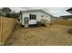 View of a backyard with a newly-installed fence and well-maintained features at 2316 Radiance Dr, Burlington, NC 27215