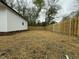 Backyard featuring a brand new fence and a new shed at 2316 Radiance Dr, Burlington, NC 27215