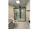 Modern bathroom featuring a glass enclosed shower with contemporary tiling and fixtures at 2316 Radiance Dr, Burlington, NC 27215