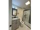 Modern bathroom featuring a glass enclosed shower and updated granite vanity at 2316 Radiance Dr, Burlington, NC 27215