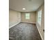Cozy room with carpeting, white trim, and bright natural light at 2316 Radiance Dr, Burlington, NC 27215