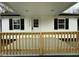 Charming home entrance with a freshly painted porch and stylish accents at 2316 Radiance Dr, Burlington, NC 27215