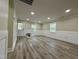Spacious living room with fresh paint, white wainscoting, hardwood floors, and ample natural light at 2316 Radiance Dr, Burlington, NC 27215