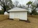 View of a newly constructed shed with double doors, and new landscaping at 2316 Radiance Dr, Burlington, NC 27215