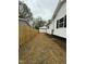 Newly fenced in side yard with fresh landscaping at 2316 Radiance Dr, Burlington, NC 27215