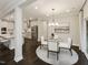 Bright dining area with a modern light fixture, connected to the kitchen at 245 E Fountainhead Ln # 161, Garner, NC 27529