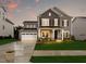 Charming two-story home boasts a well-manicured lawn and inviting front porch at 245 E Fountainhead Ln # 161, Garner, NC 27529