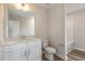 The new bathroom features a modern vanity, sink, toilet, and tub at 246 Trescott St, Smithfield, NC 27577