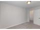 Neutral bedroom with carpeted floors, a ceiling light, and a doorway at 246 Trescott St, Smithfield, NC 27577