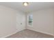 Bright bedroom features neutral walls, carpet, a double closet, and a window at 246 Trescott St, Smithfield, NC 27577