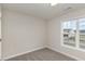 Cozy bedroom features neutral walls, carpet, and a window with neighborhood views at 246 Trescott St, Smithfield, NC 27577