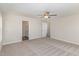 Spacious carpeted bedroom with ceiling fan and access to ensuite bathroom at 246 Trescott St, Smithfield, NC 27577