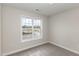 Bright bedroom with carpet, window, and neutral walls at 246 Trescott St, Smithfield, NC 27577