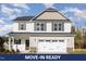 Charming two-story home featuring a large garage and appealing neutral-colored siding at 246 Trescott St, Smithfield, NC 27577