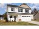 Attractive two-story home with a two-car garage and a well-manicured lawn at 246 Trescott St, Smithfield, NC 27577