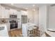 Bright kitchen features stainless steel appliances, stylish backsplash, and a center island at 246 Trescott St, Smithfield, NC 27577