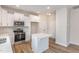 Bright kitchen features stainless steel appliances, stylish backsplash, and a center island at 246 Trescott St, Smithfield, NC 27577