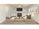 Staged living room featuring built-in shelves and a fireplace, creating a welcoming space at 246 Trescott St, Smithfield, NC 27577