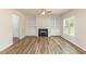 Cozy living room featuring built-in shelving and a fireplace, ideal for relaxation at 246 Trescott St, Smithfield, NC 27577