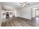 Open concept living area with hardwood floors, leading to a modern kitchen and entry at 246 Trescott St, Smithfield, NC 27577