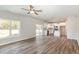 Bright, open-concept living space with wood floors and an adjacent modern kitchen at 246 Trescott St, Smithfield, NC 27577