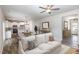 Staged open-concept living area flowing into a dining and kitchen space for modern living at 246 Trescott St, Smithfield, NC 27577
