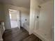 Bright primary bath with a soaking tub, shower stall, and private toilet area at 253 Trescott St, Smithfield, NC 27577