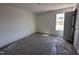A bright bedroom with natural light is streaming through a window near an open door at 253 Trescott St, Smithfield, NC 27577