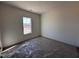 Neutral bedroom with bright natural light from a window, carpet floors, and neutral paint at 253 Trescott St, Smithfield, NC 27577