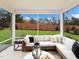 Relaxing screened porch with comfortable outdoor seating and a view of the lush backyard at 276 E Fountainhead Ln # 166, Garner, NC 27529
