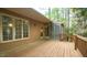 Back deck with access to the house, a screened-in porch, and natural surroundings at 2765 Rue Sans Famille, Raleigh, NC 27607
